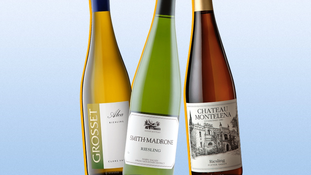 Three bottles of Riesling wine with blue background